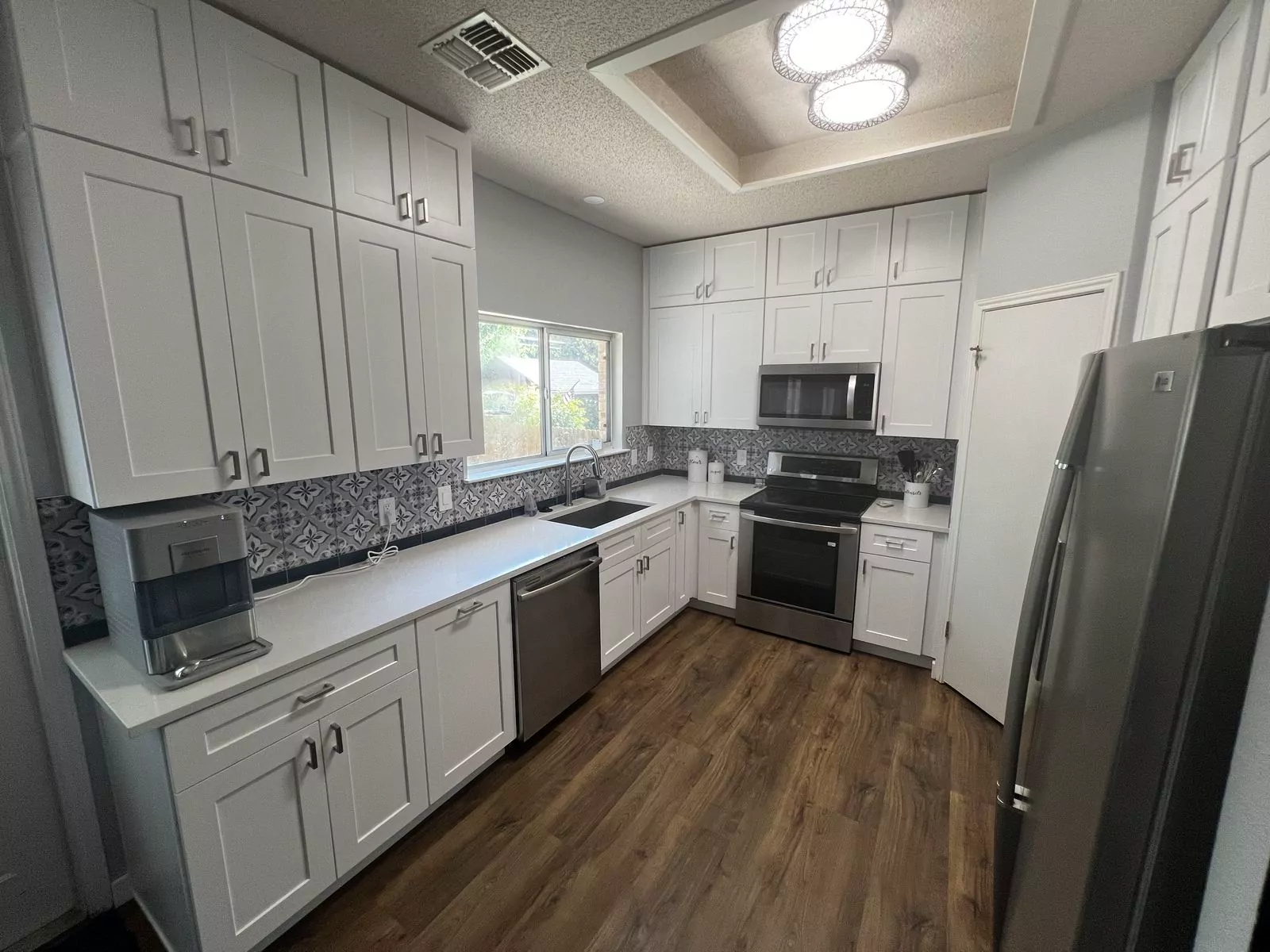 Gray shaker kitchen by Flip Fixer