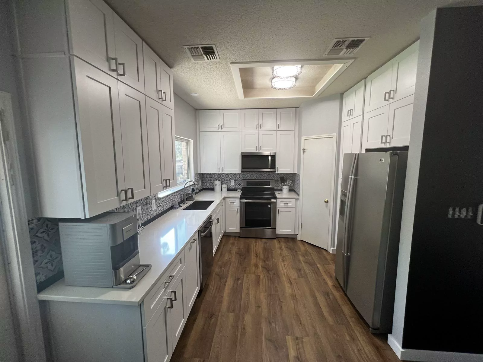 Gray shaker kitchen by Flip Fixer