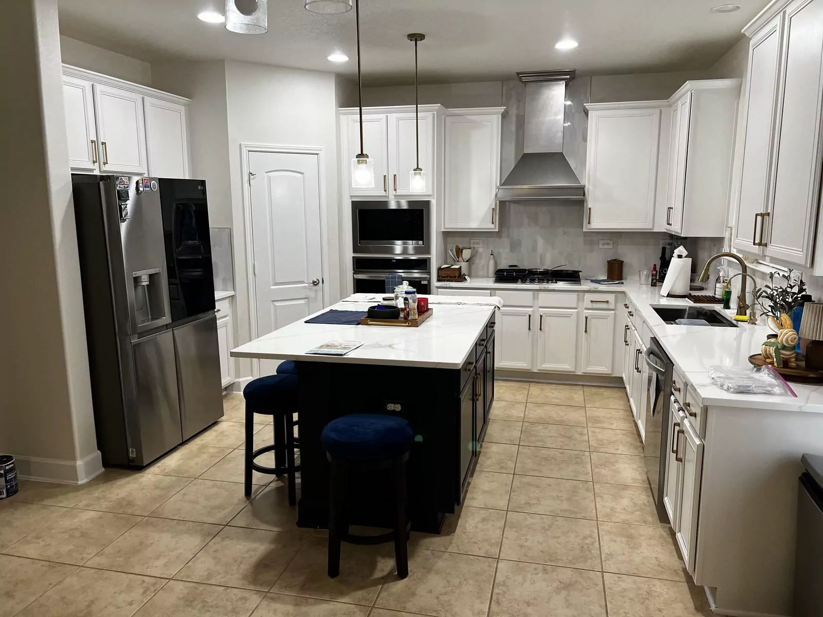 White kitchen, black island by Flip Fixer