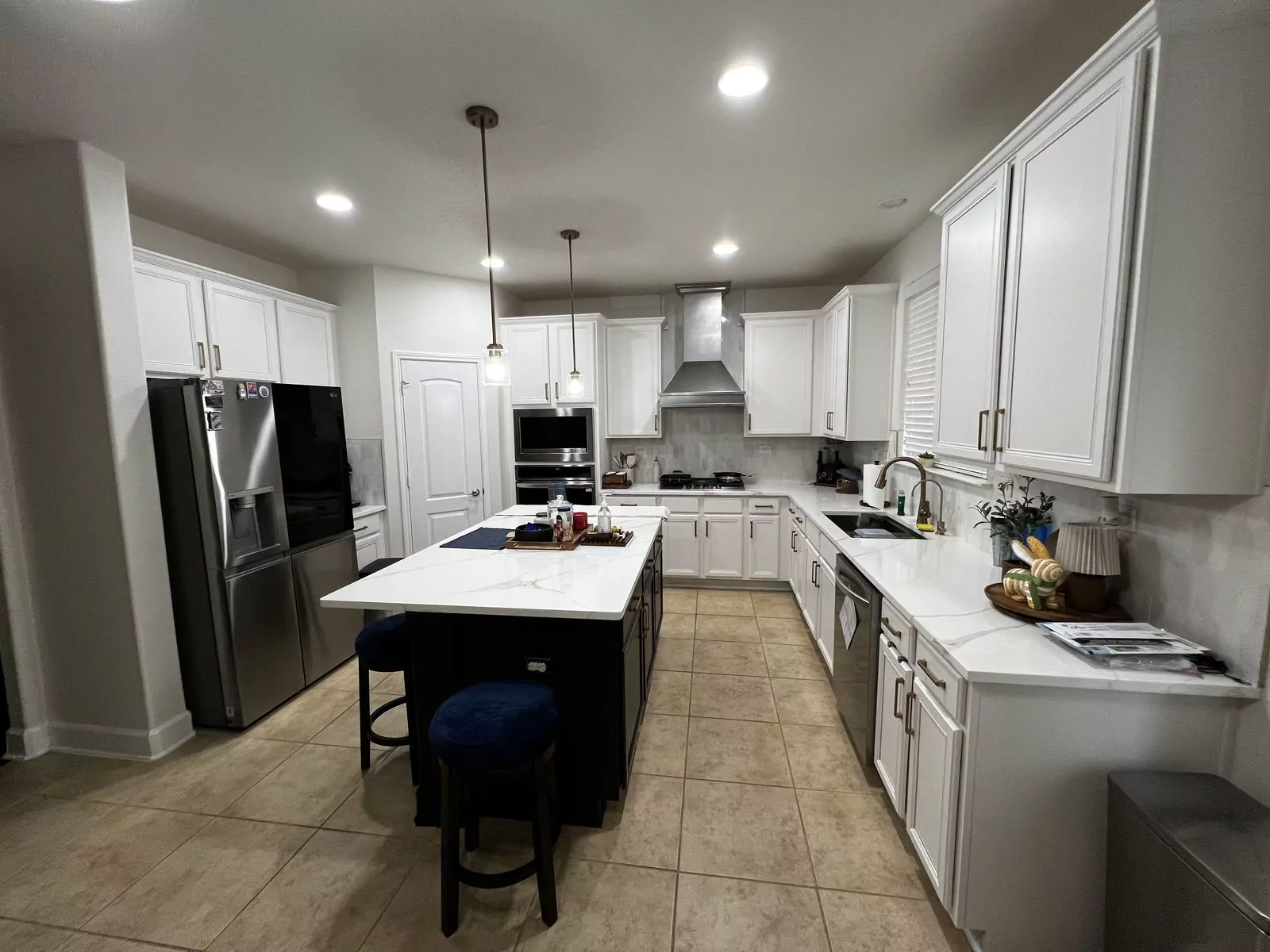 White kitchen, black island by Flip Fixer