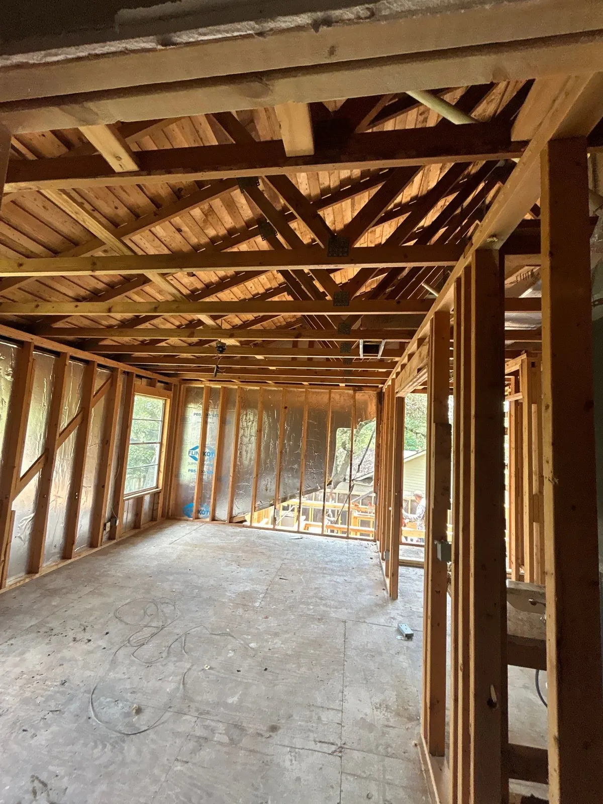 Open exposed framing during fire rebuild by Flip Fixer