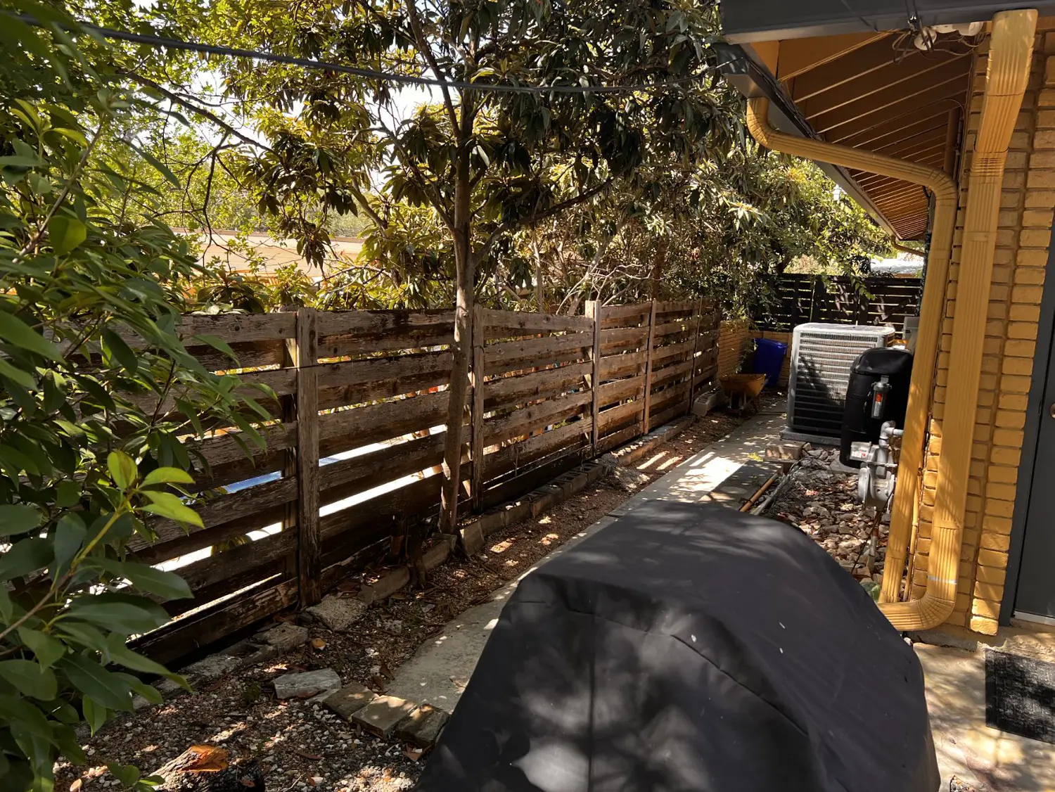 Old side-yard fence before the privacy fence
