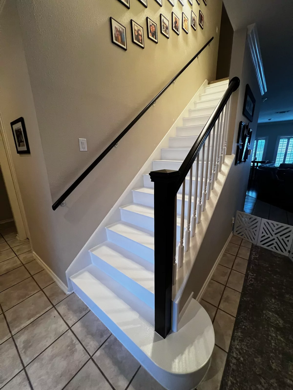Staircase with wood treads and black rail